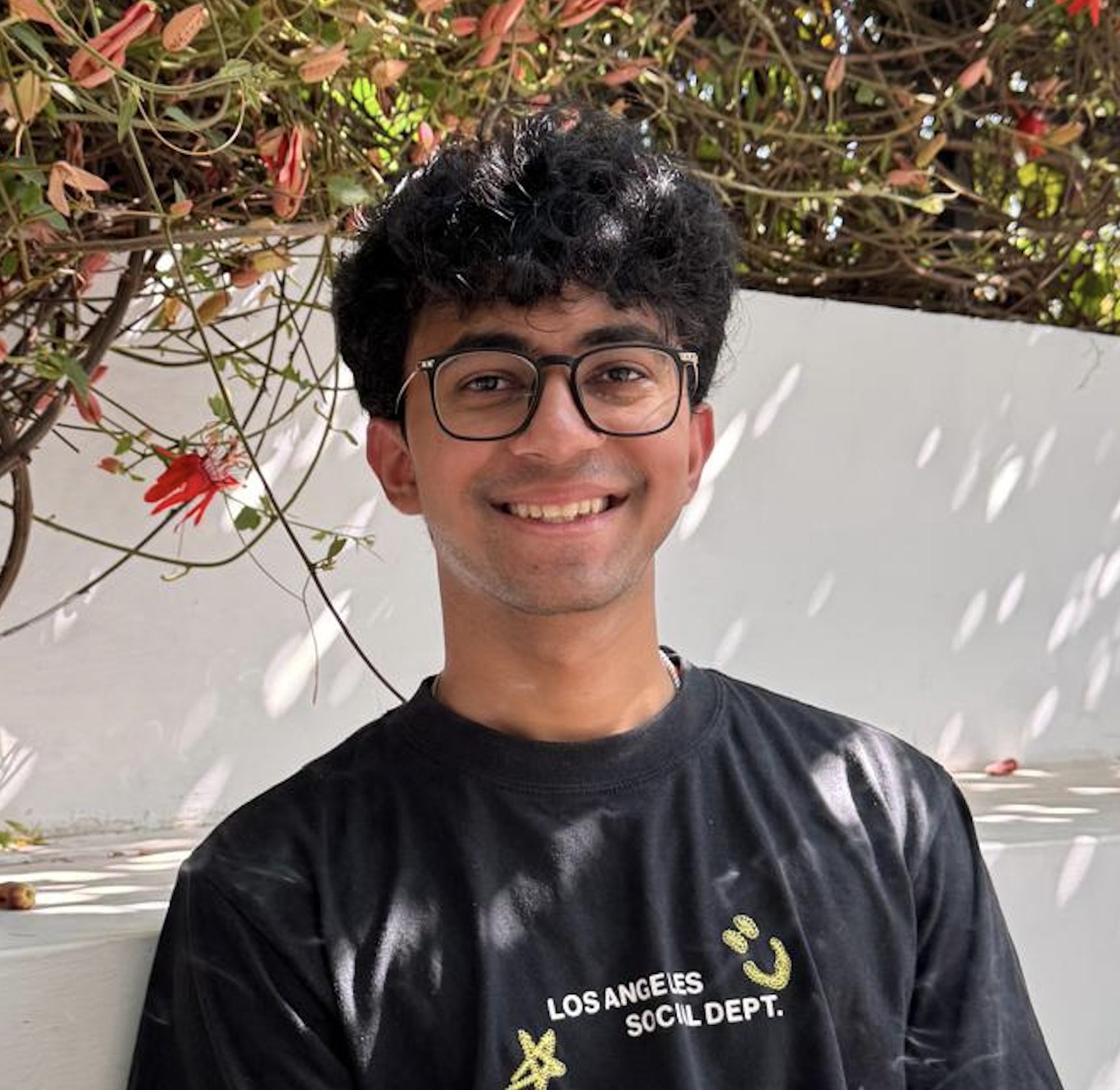 Portrait in a garden with red flowers