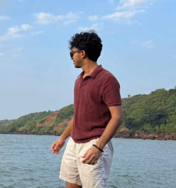 Standing on rocks by the ocean